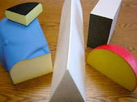 Foam shapes with acrylic coatings